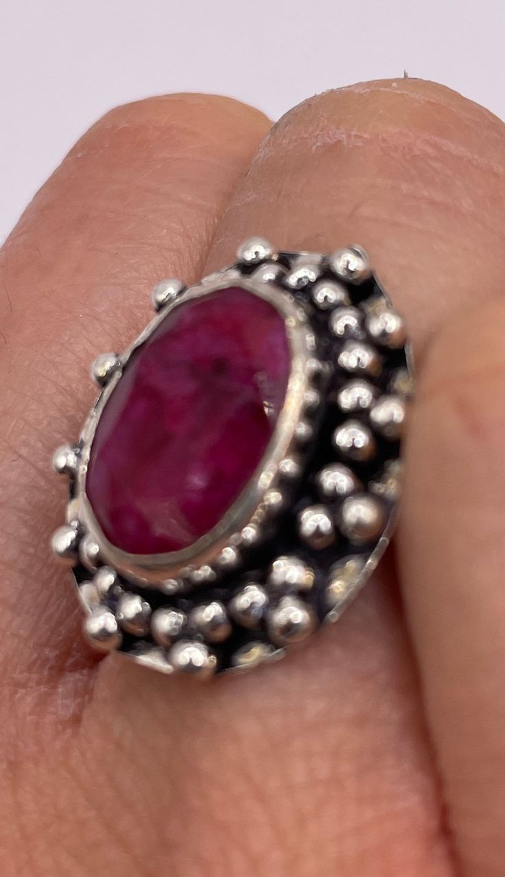 Vintage Raw Pink Ruby Deco Silver Cocktail Ring  Unusual deep toned raw Ruby low content silver setting handmade  size 7 Can be resized. My jeweler charges a $20 fee All rings are shipped in a nice gift box.   Check out our over a THOUSAND great reviews Engraving is $4 per letter and is not always perfect depending on the piece. It can take a few days if the jeweler is busy. This is payable to Paypal Judithsltd@gmail.com Handmade Oval Ruby Ring Gift, Unique Handmade Oval Ruby Ring, Bohemian Ruby Ring Gift, Unique Handmade Ruby Ring Gift, Bohemian Ruby Ring As Gift, Unique Handmade Ruby Ring As Gift, Handmade Bohemian Ruby Ring, Handmade Bohemian Oval Ruby Ring, Bohemian Handmade Oval Ruby Ring