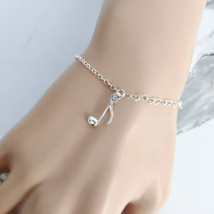 Sterling silver music note bracelet. Please note: photographs are taken close up. Please check details of the product below. 💗 925 sterling silver music note bracelet, 💗 size adjustable from 6.3 - 7.8 inches (15.5-19.5 cm), 💗 music note charm size : 16.5 x 8 mm, 💗 I use only the best quality EU sterling silver components, 💗 100% Nickel Free and hypoallergenic 💗 choose your bracelet - with or without Gift Box 💗 handmade with love  Please note: photographs are taken close up. The music note Adjustable Silver Music-themed Bracelets, Adjustable Silver Music-themed Bracelet, Silver Music-themed Bracelets For Gifts, Silver Music-themed Bracelet As Gift, Music-themed Silver Bracelet As A Gift, Silver Music-themed Bracelet For Gift, Music Note Bracelet, Music Bracelet, Note Music