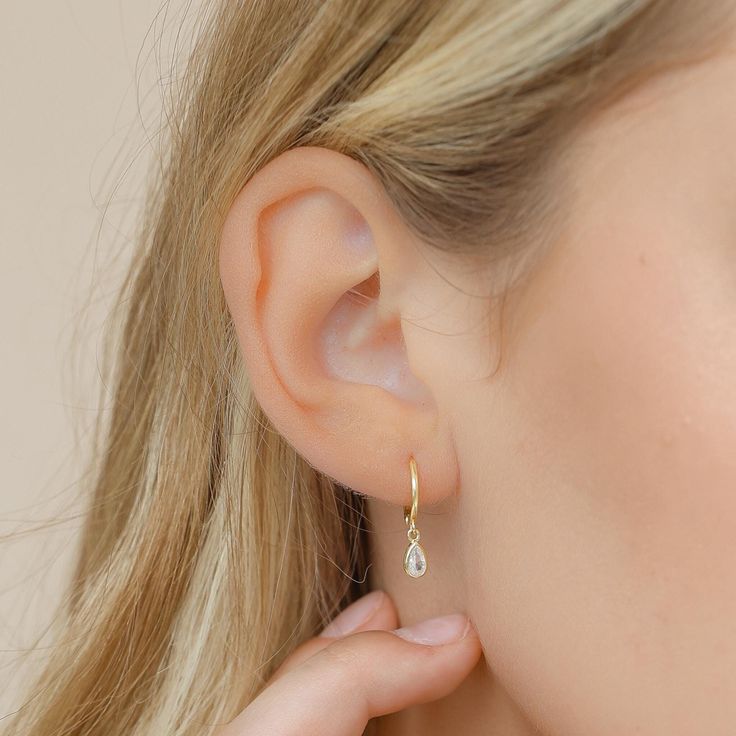 ✨ OPENING SALE: -30% OFF SALE 🛍️ADD 2 OR MORE ITEMS FOR FREE TRACKED FAST SHIPPING! Add a touch of elegance with these gold or silver finish hoop earrings, featuring teardrop-shaped crystals that shimmer with every movement. H O W ∙ T O ∙ O R D E R 1.Select options from the menu (Finish) 2.Add to cart and proceed to checkout I T E M ∙ S P E C I F I C A T I O N S * Material: High Quality Solid 925 Sterling Silver * Finish: Sterling Silver ∙ 18K Gold  * Dimensions:  20x4mm W H Y ∙ CHOOSE ∙ PIANA Minimalist Teardrop Huggie Earrings For Anniversary, Dainty Teardrop Huggie Earrings, Dainty Hypoallergenic Teardrop Earrings For Everyday, Dainty Teardrop Hoop Earrings, Tiny Teardrop Minimalist Earrings, Minimalist Drop Hoop Earrings For Anniversary, Dainty Teardrop Huggie Earrings For Everyday, Everyday Teardrop Huggie Earrings With Lever Back, Everyday Dainty Teardrop Huggie Earrings