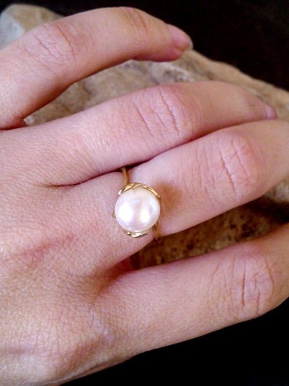 This ring features a delicate White Pearl gemstone set in 14k gold filled ring. => Gemstone Type -Natural Pearl => Gemstone Size - 8mm => Metal Type - 14k Gold Filled (Tarnish Resistant And Nickel Free) ♦ Replace the gemstone with many other gemstones we have in stock My another shops on Etsy http://www.CandySimpleJewelry.etsy.com http://www.CandyCrystalsJewelry.etsy.com Important information **My customer service is available 7 days a week ** All jewelry items will come to you nicely p Elegant 14k Gold Filled Promise Ring, 14k Gold Filled Wedding Ring, 14k Gold Filled Open Rings For Wedding, Dainty Pearl White Ring For Anniversary, Elegant Stackable Pearl Ring For Promise, Elegant Stackable Pearl Promise Ring, Elegant 14k Gold Stackable Pearl Ring, Fine Jewelry Stackable Round Pearl Ring, Elegant Stackable 14k Gold Filled Rings