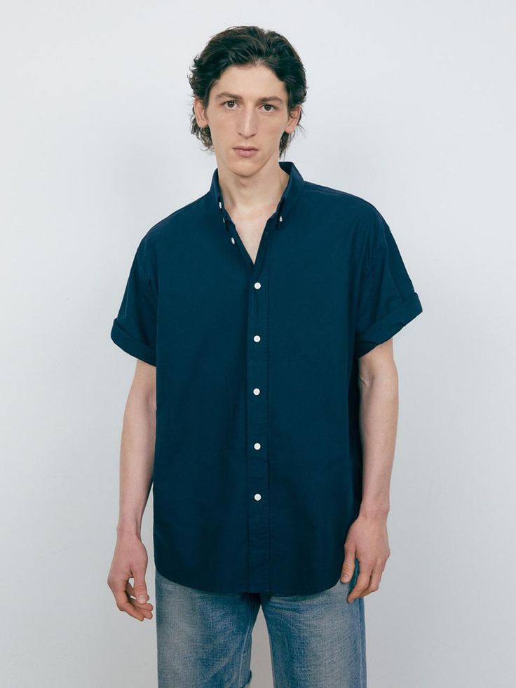 The short sleeves shirt is made of durable solid oxford fabric. The shirt is finished with bio-washing process to minimize fabric shrinking after wash. The oversized fit design makes natural silhouette and comfy fit for daily outfit.- Button down collar- Button closure- Back pleats- Round hem Relaxed Fit Short Sleeve Shirt With Rolled Sleeves, Cotton Shirt With Rolled Sleeves For Casual Gatherings, Everyday Button-up Shirt With Rolled Sleeves, Relaxed Fit Short Sleeve Button-up Shirt With Rolled Sleeves, Relaxed Fit Shirt With Buttons And Short Sleeves, Classic Short Sleeve Camp Shirt For Casual Gatherings, Short Sleeve Relaxed Fit Shirt With Buttons, Classic Cotton Short Sleeve Shirt For Daywear, Short Sleeve Button Shirt For Daywear