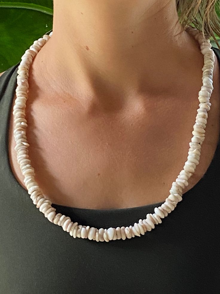 "This is a handmade,hand picked Hawaiian Puka shell necklace.The shells on this strand have been selected for size,uniformity and color(white).Subtle,petite and elegant in its simplicityIt was picked and strung by \"Uncle Whit\",a long time cultural practitioner and Rainbow Elder on one of his many beachcombing adventures here on our paradise island home,the Big Island of Hawai'i.We now bring this necklace to you,here on Etsy!Thanks for looking...Aloha!" Delicate White Mother Of Pearl Necklace, White Mother Of Pearl Necklace With Pearl Charm, White Single Strand Mother Of Pearl Necklace, White Pearl Charm Necklace In Mother Of Pearl, White Mother Of Pearl Round Bead Necklaces, Delicate White Single Strand Pearl Necklace, White Shell-shaped Shell Necklace, White Shell-shaped Necklace, White Shell Necklace With Pearl Charm