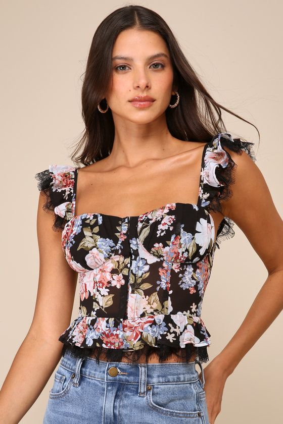 Love will always find you when you've got a romantic look like the Lulus Charmingly Sweet Black Floral Print Lace Bustier Top! Lightweight woven fabric, with a pink and blue floral print throughout, shapes this vintage-inspired top that has ruffled straps with a peekaboo of adorable eyelash lace. Bodice boasts a bustier-inspired silhouette with pleated cups and a row of hook-and-eye closures at the front. Ruffled hem boasts a matching layer of eyelash lace to complete the look. Fit: This garment Floral Bustier Top Outfit, Floral Print Fitted Corset For Party, Fitted Floral Print Corset For Party, Fitted Floral Print Party Corset, Sleeveless Spring Corset With Lined Bodice, Elegant Summer Floral Print Corset, Floral Print Fitted Corset, Summer Floral Print Corset With Fitted Bodice, Floral Print Fitted Sleeveless Corset