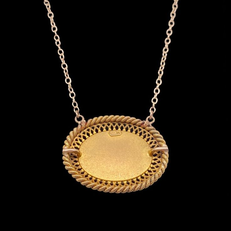 This is part of Chairish’s Fine Jewelry assortment.  A fine repurposed Victorian period 14K gold pendant with a natural polished turquoise in the center.  The bezel set stone is surrounded by a gold filigree frame.  The chain is marked 14K and is the adjustable type which allows you to wear it two inches shorter.  Condition is excellent.  The back of the pendant also has an applied small plaque stamped 14K.  It dates c. 1890.  Dimensions: 18" or 16", Pendant: Width: 1", Length: 3/4", Weight:  5. Vintage Oval Necklace With Coin Pendant, Vintage Oval Jewelry With Coin Pendant, Antique Yellow Gold Necklace With Cabochon, Gold Oval Pendant Necklace With Cabochon, Gold Oval Pendant Necklaces With Cabochon, Gold Engraved Oval Cabochon Necklace, Gold Necklaces With Oval Pendant Cabochon, Gold Necklaces With Oval Cabochon Pendant, Victorian Yellow Gold Jewelry With Large Pendant