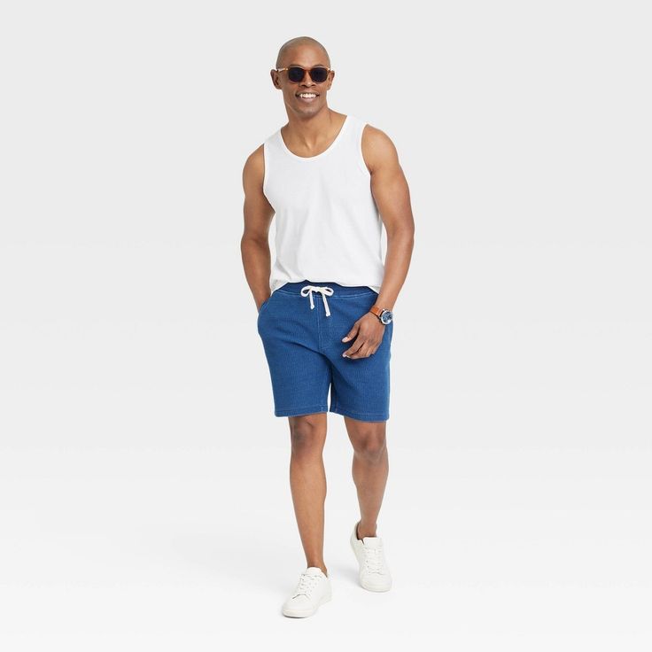 Bring cool comfort to warm-weather days with this Standard-Fit Tank Top from Goodfellow & Co™. Crafted from a lightweight jersey fabric, this standard-fit tank top offers you all-day cool comfort. Falling at the hip for wearing tucked in or untucked, you can coordinate this solid round-neck tee with different bottoms, or layer it under a button-down or hoodie for versatile styling. Goodfellow & Co™: Where style & fit are always in good company. Casual Activewear For Leisure In Spring, Casual Spring Leisure Activewear, Casual Spring Activewear For Leisure, Casual Cotton Activewear For Summer, Summer Beach Season Activewear, Comfortable Summer Activewear, Casual Cotton Activewear For Spring, Comfortable Relaxed Fit Summer Activewear, Comfortable Sleeveless Activewear For Summer