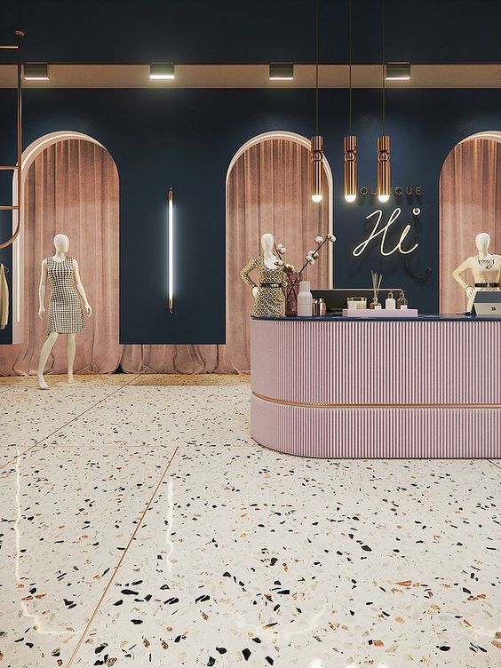 a store with mannequins in front of the counter and chandeliers hanging from the ceiling