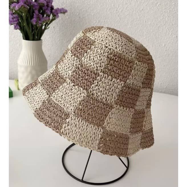 Slay in style with the Checkered Chic Bucket Hat! This trendy straw hat is perfect for any outfit and features an adjustable strap for a perfect fit. Whether you want to rock a cute, chic look or add a touch of playfulness, this bucket hat is a must-have accessory. Trendy Adjustable Bucket Hat With Curved Brim, Trendy Bucket Hat For The Beach, Trendy Bucket Hat For Vacation, Trendy Beach Bucket Hat One Size Fits Most, Trendy Bucket Hat With Short Brim For Vacation, Trendy Bucket Hat For Beach, One Size Fits Most, Trendy Vacation Bucket Hat, Trendy Short Brim Bucket Hat For Beach, Trendy Beach Bucket Hat With Short Brim