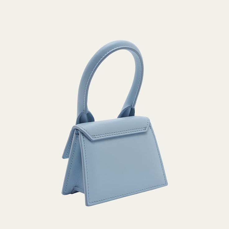 Jacquemus "Le Chiquito" top handle bag in cotton and leather  Rolled top handle  Detachable, adjustable crossbody strap Can be worn as a top handle or crossbody  Flap top with magnetic closure  Lining: Cotton Approx. 7.2"H x 4.7"W x 3.7"D Made in Italy Top Handle Baguette Bag For Shopping, Shopping Baguette Bag With Detachable Top Handle, Shopping Baguette Bag With Detachable Handle, Blue Baguette Bag With Detachable Top Handle, Blue Baguette Bag With Detachable Handle, Blue Shoulder Bag With Round Handle For Evening, Evening Baguette Bag With Top Handle, Trendy Top Handle Box Bag With Handle Drop, Chic Baguette Bag With Round Top Carry Handle