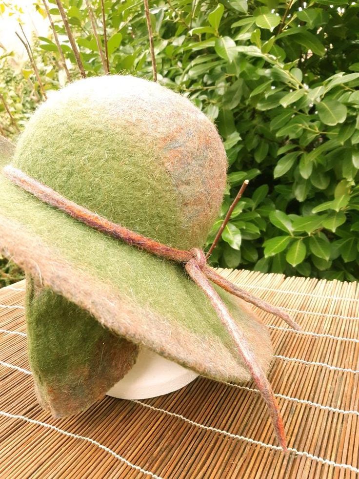 Green felted wool hat with wide brim Handmade by Estambul Atelier. Materials: 100% natural and organic Merino wool. Adult - one size. **Made to Order** There may be a slight design/ colour variance compared to the images as each piece is hand made to order. Made with the wet felting technique using warm water and pure olive oil soap to blend the natural fibres into a strong and breathable fabric. I recommend hand washing, but can be machine washed using the wool/ delicate setting at a cool tempe Olive Oil Soap, Natural Fibres, Wet Felting, Felted Wool, Wool Hat, Natural Fibers, Hand Washing, Warm Water, Wool Felt