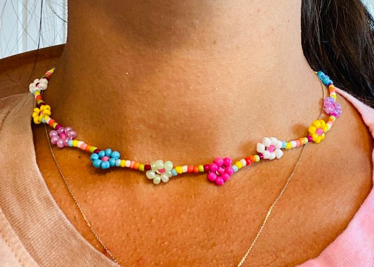 "This y2k-inspired beaded flower necklace is the perfect summer accessory for any outfit! It also makes the perfect little addition to any bachelorette party gift, girlfriend gift, etc. SIZE: Approx 12\" long with adjustable closure.  I'd love to see what you do with your purchase from my shop! You can share posts with me on Instagram: @RissandThat **This listing includes ONE (1) beaded necklace.** RETURNS: No returns or refunds, however if you have any problems with your order please reach out Cute Flower Necklaces For Summer, Cute Flower Necklace For Summer, Trendy Multicolor Necklace With Flower Charm, Trendy Multicolor Beaded Flower Necklace, Dainty Multicolor Flower Necklace, Colorful Beaded Flower Necklace For The Beach, Dainty Beaded Necklaces For Spring Gift, Trendy Multicolor Flower Necklace With Colorful Beads, Colorful Beaded Flower Necklace For Beach