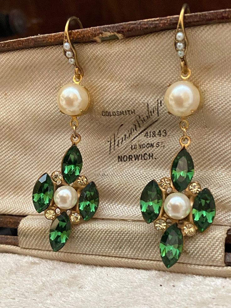 Vintage Green Turmaline & Jonquil Swarowski Crystal  and faux pearl  Drop Pierced Earrings. Lovely quality.  Width at widest point 1.7 cms  Length from the top of the Hook 6 cms.  These have not been worn but are quite old as many years ago we bought the contents of a small company L F Coverdale Est. 1952 that made some of Butler & Wilsons jewellery and this was amongst the treasure trove! I have shown a box in the pictures but it is not part of this sale, it is Presented in a quirky re-cycled m Victorian Green Earrings For Wedding, Green Pearl Earrings For Wedding (may Birthstone), Elegant Dangle Pearl Earrings For May Birthstone, Elegant Green Jeweled Bridal Earrings, Green Pearl Earrings For Wedding And May Birthstone, Green Teardrop Pearl Earrings For Wedding, Green Pearl Earrings For Wedding, Elegant May Birthstone Crystal Earrings For Wedding, Green Drop Pearl Earrings For Wedding