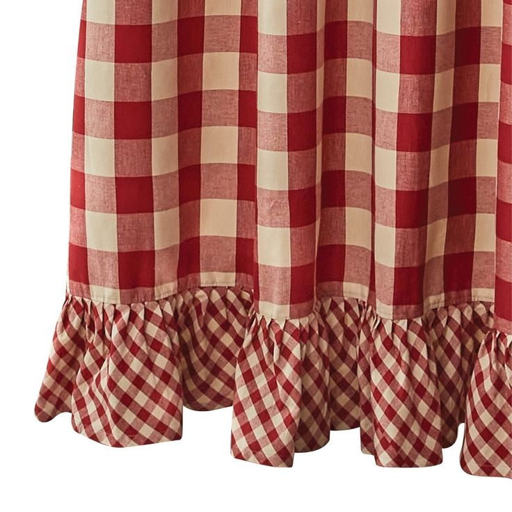 a red and white checkered curtain with ruffles