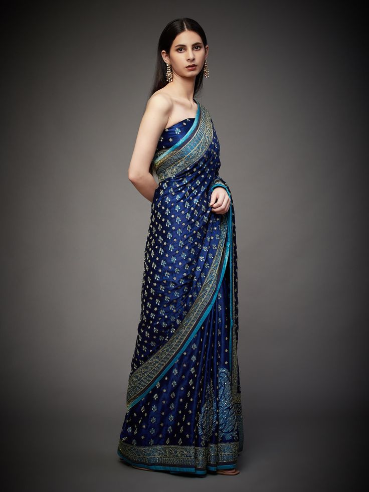 Editor's Note Embrace royal elegance with our royal/turquoise ari with tikki-h embroidered parampara ari 60 kasab sari, complete with an unstitched blouse. This ensemble is the epitome of traditional opulence, perfect for special occasions and events where you want to make a regal and sophisticated statement. The intricate embroidery and rich color combination ensure you stand out and leave a lasting impression. With the convenience of an unstitched blouse, you can customize your look to your li Designer Blue Tissue Silk Pre-draped Saree, Blue Tissue Silk Pre-draped Designer Saree, Blue Tissue Silk Pre-draped Saree For Designer Wear, Blue Fitted Tissue Silk Pre-draped Saree, Blue Fitted Pre-draped Tissue Silk Saree, Blue Tissue Silk Saree Set, Blue Tissue Silk Sets With Traditional Drape, Blue Pre-draped Saree With Unstitched Blouse In Tissue Silk, Blue Pre-draped Tissue Silk Saree With Unstitched Blouse