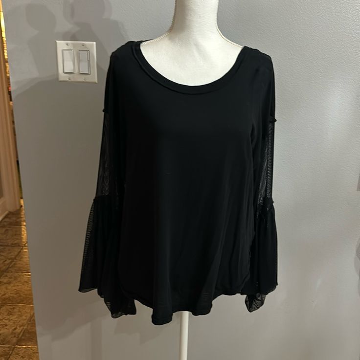 Very Cute And Comfy Oversized Black Free People Brand Blouse,Brand New No Tags,Fits Medium And Large Because Of The Style Chic Black Long Sleeve Top With Sheer Sleeves, Black Stretch Long Sleeve Top With Sheer Sleeves, Black Long Sleeve Top With Sheer Stretch Sleeves, Black Long Sleeve Top With Sheer Sleeves, Fall Black Top With Sheer Sleeves, Black Tops With Sheer Sleeves For Fall, Black Top With Sheer Sleeves For Fall, Black Blouse With Sheer Long Sleeves, Oversized Black Long Sleeve Top For Spring