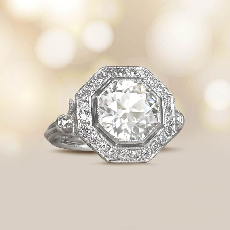 a white diamond ring with diamonds around it