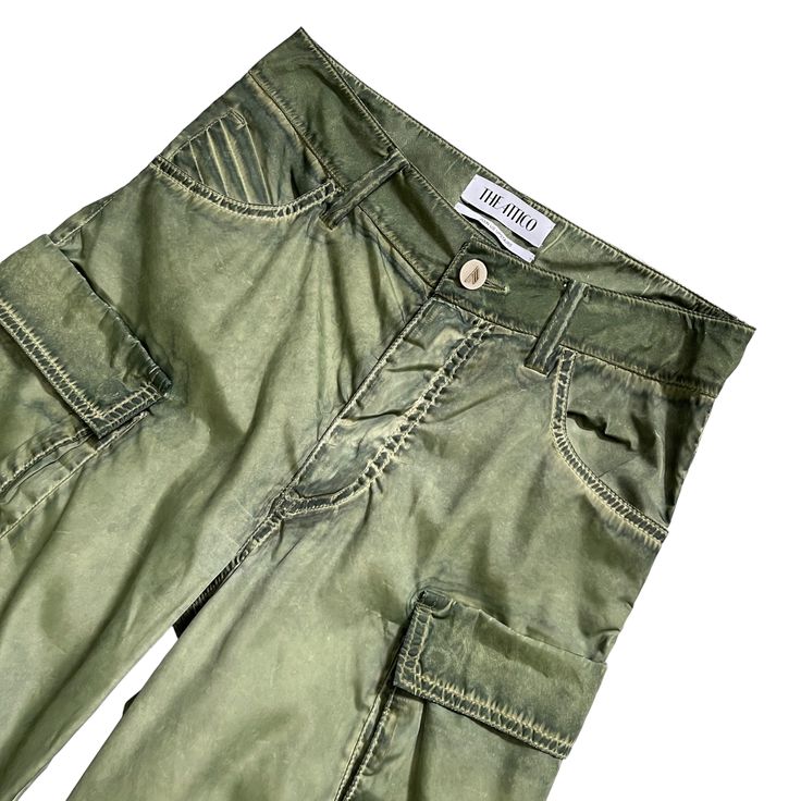 THE ATTICO Fern Long Pant in Military GreenSize 36IT // US XXSmallColor Wash Green Preloved **Fading and blemishes of color are part of these pants' style.**Please check measurements and brand size chart before purchasing.**Both sides of the pants had loose threads and were professionally repaired. Please take a look at pictures number 4 and 5.Approx. Measurements Inseam 34.5"Waist 14.5"Hips 17.5"Rise 11"Website DetailsSelf: 100% polyesterLining: 100% cotton. Made in Italy. Hand wash. Zip fly wi Green Summer Cargo Pants With Belt Loops, Fitted Green Pants With Five Pockets, Fitted Green Wide-leg Jeans, Green Cargo Style Tapered Jeans, Green Cargo Pocket Jeans For Summer, Summer Jeans With Cargo Pockets, Fitted Green Cargo Pants For Summer, Fitted Green Bottoms With Pockets, Summer Trousers With Five Pockets