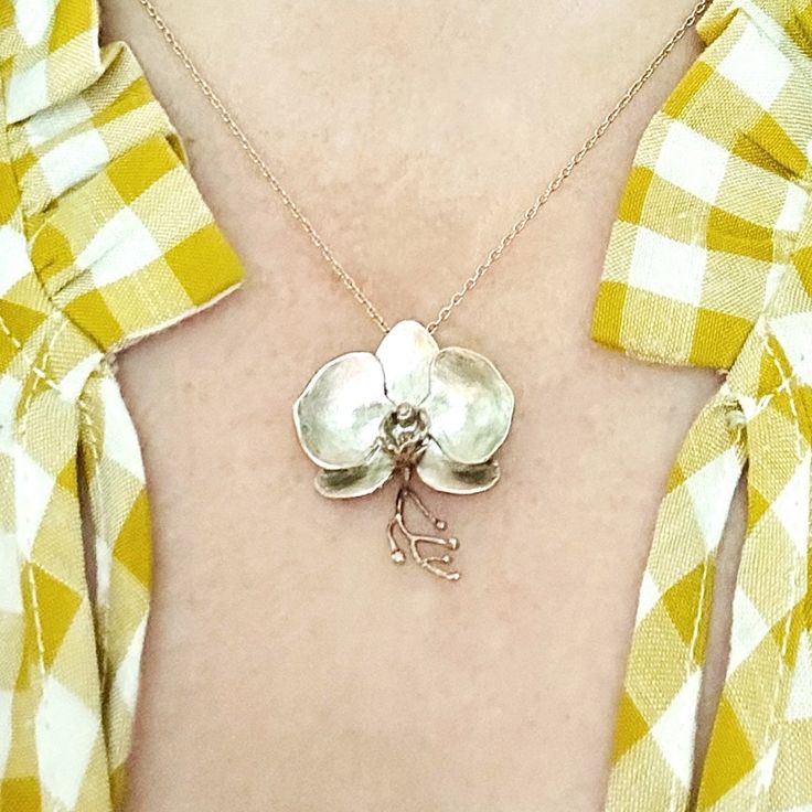 Orchid pendant
 	Solid sterling silver
 	Hand finished
 	Also available in bronze Orchid Pendant, Elizabeth Jewelry, Blossom Jewelry, Silver Flowers, Flower Pendant, Pendant Jewelry, Statement Pieces, Orchids, Jewelry Necklace Pendant