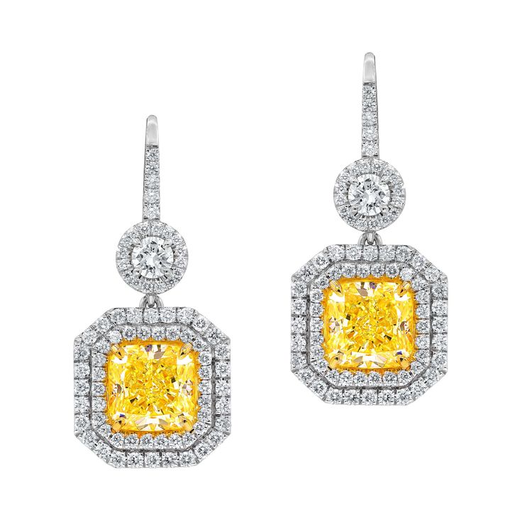 18kt fancy light yellow diamond earring set in a double halo setting, features gia certified yellow diamonds, 2.61ct vs1(rad1038) and 3.02ct vs2(radc1040) of fancy light yellow cushion cut diamonds and 1.75 carats of white diamonds around f-g/vs Yellow Diamond Earrings, Canary Yellow Diamonds, Pink Diamond Earrings, Yellow Diamond Earring, Fancy Light, White Diamond Earrings, Halo Diamond Earrings, Yellow Diamonds, Fancy Yellow Diamond