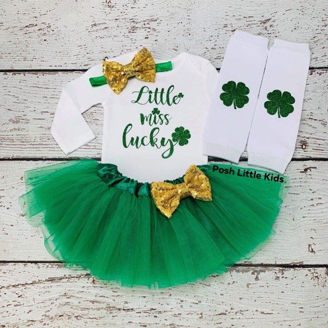 "St. Patrick's Day Girls Outfit TOP INFO: Our best seller St. Patrick's Day Girls Outfit professionally heat pressed with green and gold glitter vinyl Can be made in other numbers as well. Please leave a note to seller during checkout your preferences. S/S means Short Sleeves L/S means Long Sleeves TUTU INFO: Tutus will be made according to your top size. 3 full layers. Stretchy waist with 6\", 11\" length. SET INFO: When you pick 4-PIECE SET INCLUDES: Top, Skirt, Headband and Leg warmers SHIPPI St Pattys Outfit, St Patricks Outfit, St Pattys Day Outfit, Green Tutu, Chose Outfit, St Patrick's Day Outfit, St. Patricks Day, Tutu Outfits, Birthday Tutu