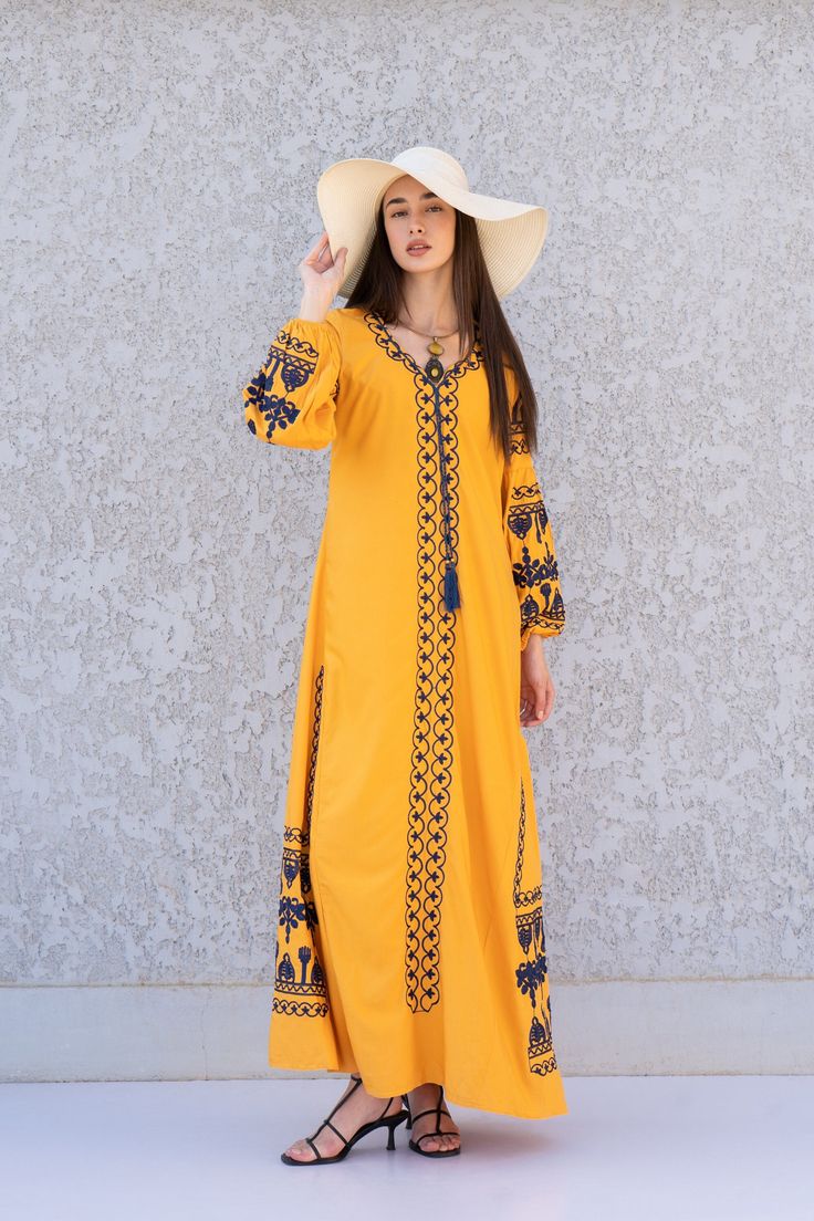 **Note : The kaftan in the video is a different color of the exact same Kaftan and is only displayed to show the fit, flow, and cut of the Kaftan. You will receive the one in the pictures.** This bohemian embroidered dress is a an eye catcher! It is an extremely comfortable wear, light and soft and can be used on many occasions -  home gatherings, festival parties, summer occasions, dinners, or just in your home to feel comfortable.  Fabric : 70% Egyptian Cotton; 30% Polyester. Small (Size 4/6 U Bohemian Dresses With Dabka Work, Bohemian Embroidered Dress With Dabka Work, Folk Style Chikankari Embroidery Dress For Eid, Bohemian Maxi Dress With Dabka Work, Summer Long Sleeve Kaftan With Dabka Work, Yellow Long Sleeve Embroidered Dress For Spring, Yellow Tunic Dress With Floral Embroidery, Eid Maxi Dress With Intricate Embroidery, Yellow Long Sleeve Embroidered Spring Dress