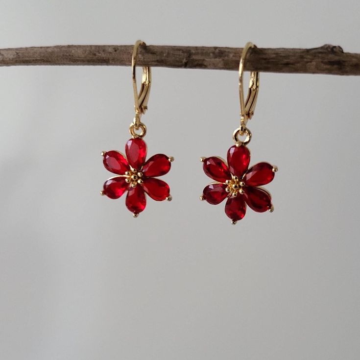 Ruby Red Flower Jewel Huggie Hoop Earrings,  Gold Plated Earrings, Vintage Style Earrings, Victorian Earrings Product specifications: * Material: 14K Gold Plated Brass * Size Each charm measures 1.8 cm x 1.35cm.  Hoops: 1.4cm long. Hooks: 1.8cm long Dainty Hooks: 1.6cm long, sterling silver base. Packaging and Gifts: * All pieces of jewellery are sent in a mesh jewellery pouch with a thank you card.  Shipping: * All Australian orders will be shipped out within 1 - 3 days by standard untracked le Ruby Gold Earrings, Victorian Earrings, Vintage Style Earrings, Huggie Hoop Earrings, Red Flower, Earrings Vintage, Style Earrings, Gold Plated Earrings, Jewelry Earrings Hoops