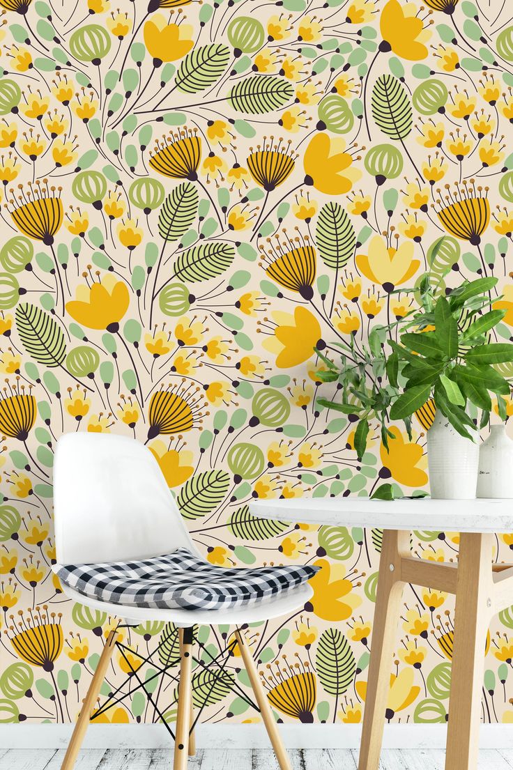 the wallpaper in this room is very colorful and has yellow flowers on it, as well as green leaves