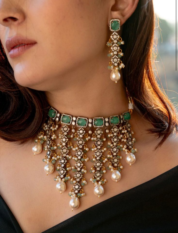 Enhance your traditional attire with this Stunning Choker necklace set. This intricate piece is encrusted with polkis and cubic zirconia, complemented by mint flourite stones for a touch of elegance. The trinkets of pearls and mint onyx add a classic touch. Complete the set with the matching earrings for a stunning traditional statement look.  Necklace Closure - Adjustable Dori Earrings Closure - Push Back  A feeling more than just material pleasures, our range of everyday jewels is like a ritua Lehenga Jewellery Ideas Simple, Long Kundan Necklace, Pearl Bridal Jewelry Sets, Sabyasachi Designer, Sabyasachi Mukherjee, Pearls Choker, Jewelry For Wedding, Necklace Closure, Choker Necklace Designs