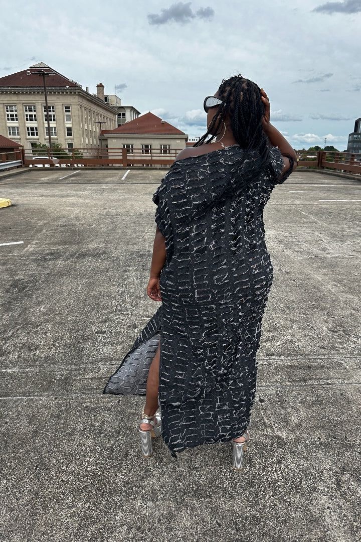 Denim will ALWAYS be a vibe and this light weight denim maxi dress does not disappoint! Cut slits throughout this flowy statement piece that has multiple styling options to give you an edge! Leg split allows comfort and versatility to be worn on either side. In One Size fits up to XL Styling tip: Can be worn over jeans, dresses, on it's own. Dress is not see through. Styling options are endless! Available in Medium Blue , Dark Denim and Black Denim Size US Size One Size Black Maxi Dress With Side Slits For Vacation, Casual Long Midi Dress With Side Slits, Trendy Long Summer Maxi Dress, Trendy Long Maxi Dress For Summer, Oversized Linen Maxi Dress For Spring, Chic Longline Maxi Dress For Day Out, Maxi Dress With Side Slits For Day Out, Casual Long Dresses With Side Slits, Oversized Casual Maxi Dress