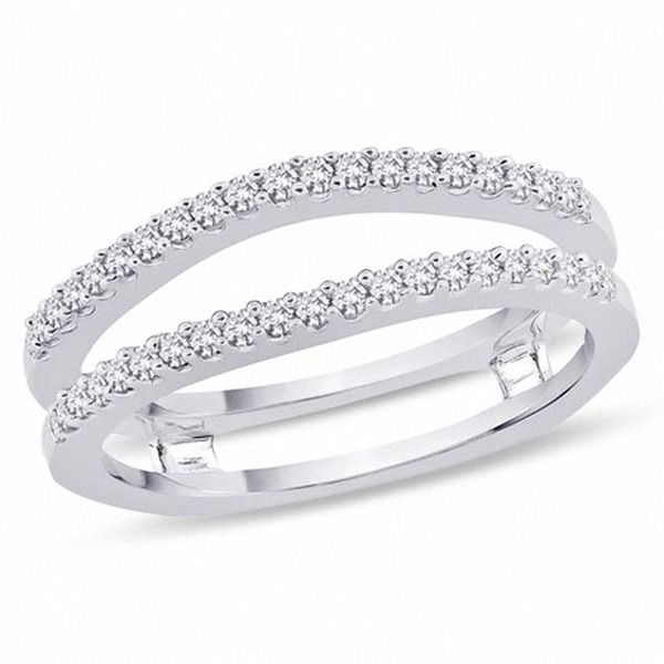 two white gold wedding bands with round diamonds on each band, set in 18k white gold