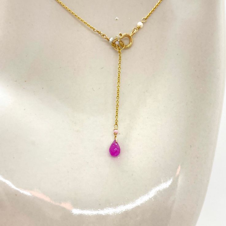 "Wire, Chain & Clasp: 14k Gold Stones: Pink Sapphires (approx. 3.5mm), Freshwater Pearls (approx. 1mm x 2mm), 18k Gold Daisy (approx. 2mm), 18k Gold Loop (approx. 5mm) Beads: Antique Italian Glass (approx. 1mm) Necklace Length: approx. 17\" Backdrop: Sapphire & Antique Italian Beads Backdrop Length: 1.6\" ------------------------------------------------------------ Let me know if you have any questions! *Size adjustable at client's request 693" Elegant Drop Necklace With Gemstone Beads, Yellow Gold Jewelry With Pearl Drop Round Beads, Yellow Gold Pearl Drop Jewelry, Gold Single Strand Drop Necklace As Gift, Yellow Gold Lariat Jewelry With Pearl Chain, Pink Rondelle Elegant Jewelry, Yellow Gold Pearl Chain For Jewelry Making, Elegant Rose Gold Necklaces With Gemstone Beads, Elegant Pink Rondelle Jewelry