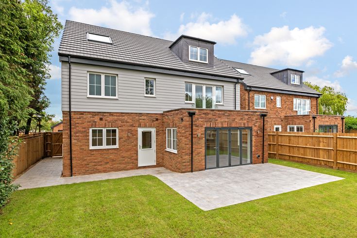 a house with a large yard and fenced in area