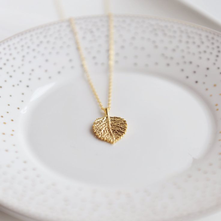 This dainty necklace will add a special touch to everyday outfits. 18" 16k gold plated brass necklace. Delicate 14k Gold Filled Jewelry Gift For Mom, Delicate 14k Gold Filled Jewelry For Mom, Dainty 16 Inch Yellow Gold Necklace, Dainty Yellow Gold Necklace 16 Inch, Elegant Hypoallergenic Yellow Gold Charm Necklace, Delicate Gold Charm Necklaces In Brass, Elegant Yellow Gold Hypoallergenic Charm Necklace, Dainty 14k Gold Filled Charm Necklaces For Mom, Minimalist 14k Gold Filled Necklace As Gift For Her