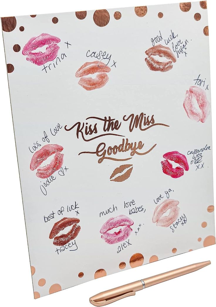 kiss the miss goodbye notepad with rose gold lip prints on it and a pen next to it