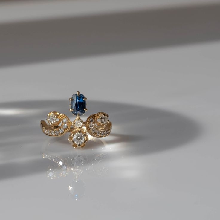 two rings with blue and white stones on them