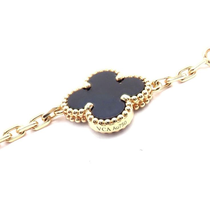 Van Cleef & Arpels 18k Gold 20 Motif Black Onyx Alhambra Necklace. This stunning necklace comes with a certificate of authenticity from Van Cleef & Arpels (originally purchased in 2021), and a VCA pouch.   Van Cleef & Arpels Retail Price: $17,300 (excluding taxes).  Metal: 18k yellow gold Length: 34" Width: 15mm Weight: 46.5 grams Stones: 20 alhambra shape black onyx stones Hallmarks: VCA 750 JC805XXX(serial number has been omitted) Elegant 14k Gold Jewelry With Black Enamel, Luxury Black Enamel Round Necklace, Luxury Onyx Jewelry For Formal Occasions, Elegant Black Bracelet With Adjustable Chain, Luxury Round Onyx Jewelry, Luxury Black Enamel Jewelry For Formal Occasions, Luxury Onyx Jewelry, Designer Black Necklace As A Gift, Designer Black Necklace For Gift