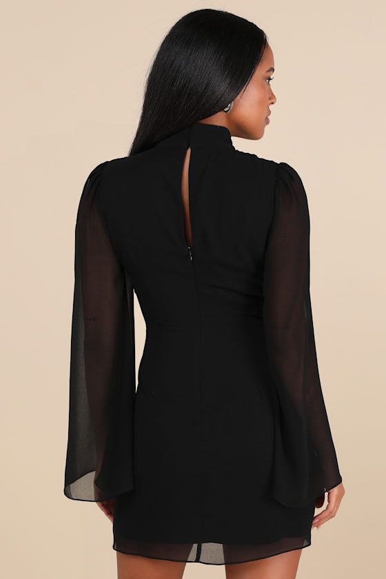 We promise that everyone will be obsessed with the flawlessness of the Lulus Guaranteed Chicness Black Mock Neck Mini Dress! Lightweight woven chiffon shapes this cute and elegant dress that features semi-sheer, bell-style long sleeves with gathering at the shoulders and a classy mock neck (that secures with bottom-loop closures at the back). The figure-skimming, fit-and-flare silhouette falls to a breezy mini hem. Keyhole cutout and hidden zipper/clasp at back. Fit: This garment fits true to si Fitted Mini Dress With Sheer Sleeves, Chic Sheer Mini Dress For Cocktail, Flowy Chiffon Dress With Sheer Sleeves, Fitted Mini Dress With Sheer Back For Cocktail, Chic High Neck Dress With Back Zipper, Cocktail Mini Dress With Sheer Back, Elegant High Neck Dress With Back Zipper, Fitted Sheer Chiffon Mini Dress, Fall Party Chiffon Midi Dress