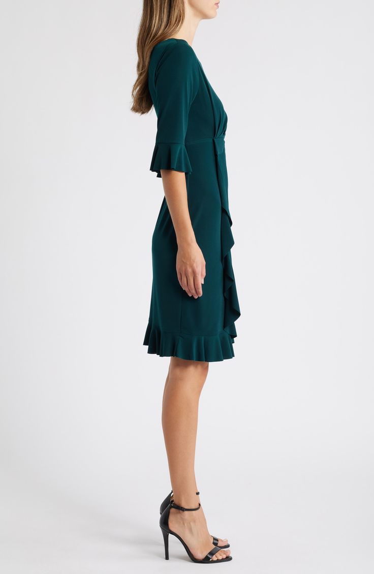 Stretch-enhanced fabric offers desk-to-dinner comfort in a dress framed by ruffled sleeves and finished with front pleats for a gathered affect. 40" length (size 8) Jewel neck Elbow-length sleeves Partially lined 100% polyester Machine wash, tumble dry Imported Elegant V-neck Pleated Dress With Ruffles, Elegant Green V-neck Ruffle Dress, Green Formal Dress With Pleated Sleeves, Elegant Green Pleated Mini Dress, Elegant Green Midi Dress With Pleated Sleeves, Knee-length Cocktail Dress With Ruffle Hem, Cocktail Knee-length Dress With Ruffle Hem, A-line Dress With Ruffle Hem For Work, Green Pleated Sleeve Dress For Work