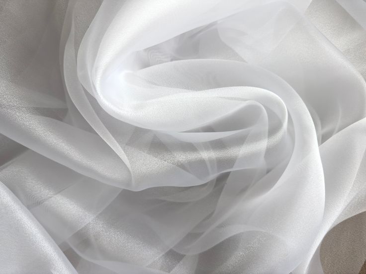 the white fabric is flowing in the wind