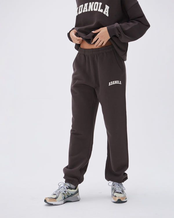 Varsity Sweatpants - Coffee Bean Sportswear Sweatpants With Letter Print For Loungewear, Athleisure Joggers With Letter Print For Loungewear, Letter Print Joggers For Loungewear, Athleisure Letter Print Joggers For Loungewear, Fleece Sweatpants With Ribbed Cuffs For Lounging, Fleece Sweatpants With Elastic Waistband For Loungewear, Casual Letter Print Joggers For Loungewear, Relaxed Fit Fleece Pants For Lounging, Sporty Sweatpants With Letter Print For Loungewear