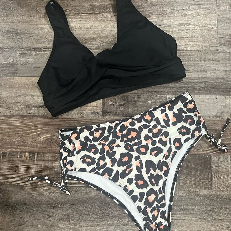 Nwt. Size Large. Top Has Removable Pads. Bottom Is High Waisted With Moderate Coverage. The Cheetah 2 Piece Bikini Swimsuit Is A Perfect Combination Of Classic Style & Modern Sensibility. An Animal Print Bottom Balances Out With A Solid Black Top For A Look That's Both Laidback And Chic. Black Tankini With Built-in Bra For Beach Party, Black Lined Tankini For Beach Party, Black Ruched Swimwear For Sunbathing, Black Ruched Swimwear For Pool, Black Ruched Tankini For The Beach, Black Lined Tankini For Vacation, High Waist Black Swimwear For Beach Party, Black High Waist Swimwear For Beach Party, Black High-waist Swimwear For Beach Party