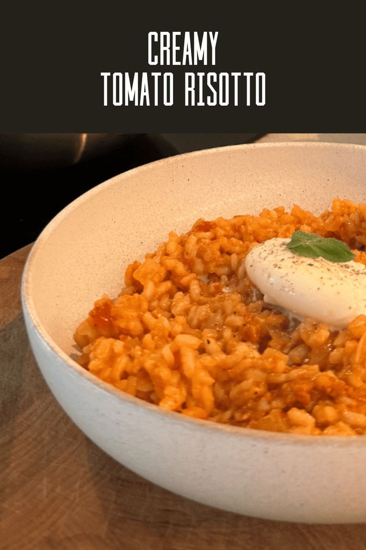 a white bowl filled with food on top of a wooden table