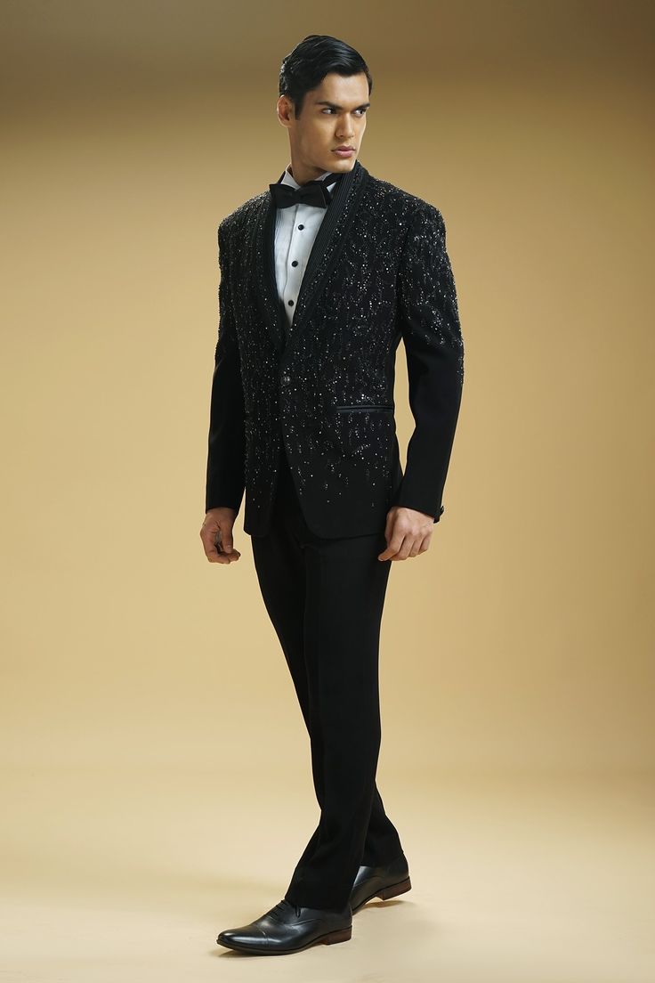 Black full sleeve all over sequin and cutdana embroidered tuxedo. Paired with a pintuck detailed shirt and trouser. Comes with a bow-tie.
Component: 4
Pattern: Embroidered
Type Of Work: Sequin,Cutdana
Neckline: Lapel Collar
Sleeve Type: Full Sleeves
Fabric: Kupro, Cotton 
Color: Black,White
Other Details: 
Single button closure tuxedo
Pintuck detailed shirt
Occasion: Party,Cocktail and Reception - Aza Fashions Party Suits With Sequins And Long Sleeves, Sequined Long Sleeve Party Suits, Party Wear Long Sleeve Suits, Luxury Long Sleeve Suits For Party, Luxury Long Sleeve Party Suits, Luxury Party Suits, Embroidered Fitted Tuxedo With Long Sleeves, Embroidered Fitted Long Sleeve Tuxedo, Wedding Suits With Sequins