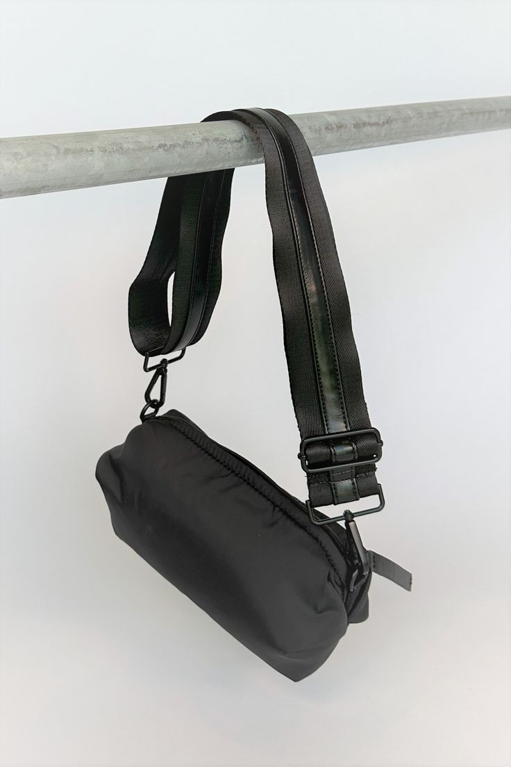 black nylon belt bag with black crossbody strap with shiny black leather detail Trendy Black Bag Strap For On-the-go, Multifunctional Black Crossbody Shoulder Bag, Casual Black Chest Bag With Detachable Strap, Functional Black Nylon Shoulder Bag, Black Crossbody Bag Strap With Removable Pouch, Black Bag Strap With Removable Pouch For Daily Use, Black Bag With Detachable Strap For Outdoor, Black Chest Bag With Detachable Strap For Daily Use, Multifunctional Black Nylon Shoulder Bag