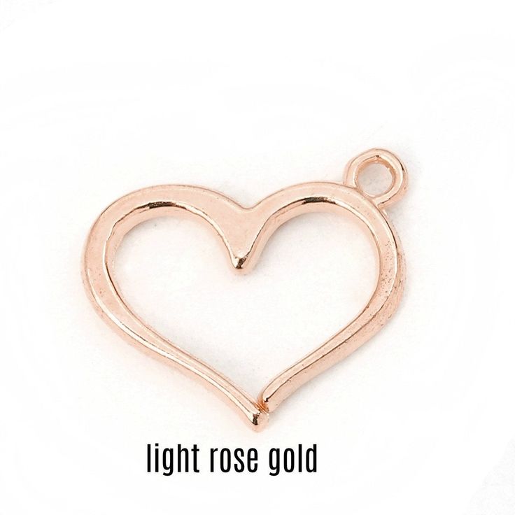 Smooth open design heart charm 16 mm (5/8 inch) x 13mm (1/2 inch). Heart charm is flat 2 mm thick with slightly curved edges. Charms are lightweight, have nice clean lines, smooth shiny finish, and are a good size for earrings, necklace or bracelet designs. Available in silver tone, gold plate, and light rose gold colors Choose color and pack size pack of 2 or 4 charms at check out. Use for jewelry, gift tie on, zipper pull, purse charm or whatever you imagine. On multiple item purchases you wil Heart Pendant Charms For Jewelry Making, Mother's Day Heart Charm Pendant, Heart Charm For Mother's Day, Rose Gold Heart-shaped Charm For Gift, Valentine's Day Heart Pendant Dangling Charms, Valentine's Day Heart-shaped Dangling Charms, Nickel Free Metal Heart Charms, Nickel-free Heart-shaped Metal Charms, Rose Gold Charm Necklace With Round Heart Pendant