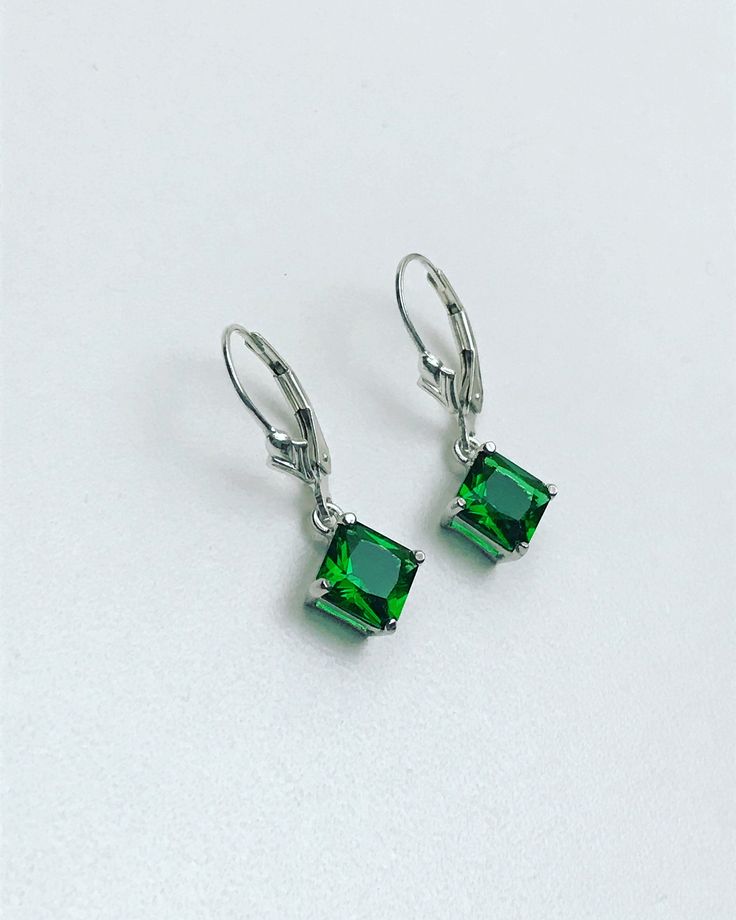 "Sterling Silver Emerald Princess Cut Dangle Earrings Minimalist and Simple Lightweight Earrings Stone: 7mm EmeraldCZ Metal: All components are made from solid .925 Sterling Silver Measurement: Earrings dangle approx. 1\" from top of ear wire *Earrings can be made with either lever backs or french hooks. *Choose Desired Earlier At Checkout You can find other Earrings in my shop here https://www.etsy.com/shop/LinksAndStones?ref=seller-platform-mcnav&section_id=24232772 Please feel free to Con April Birthstone Necklace, White Opal Earrings, Small Dangle Earrings, Lotus Earrings, Starburst Earrings, Earrings Stone, May Birthstone, Sterling Silver Dangle Earrings, Cz Earrings