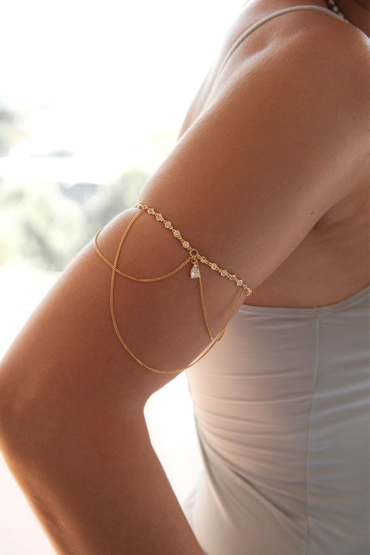 Feel like a true goddess with one of these beautiful CZ Upper Arm chains. This Gold Filled Arm Bracelet is a sparkling, gorgeous accessory for all your witchy needs and an effortlessly easy yet classic addition to any wardrobe you might need for a momentous day just around the corner. Add a bohemian element to your look with our beautiful, ethereal piece of Women Medusa Jewelry like this arm chain. Add a little flair to her wardrobe - this elegant CZ Boho Brass Armlet is one piece of jewelry she Gold Spiritual Crystal Bracelet For Wedding, Gold Bohemian Crystal Bracelet For Wedding, Bohemian Gold Crystal Bracelet For Wedding, Jóias Body Chains, Arm Accessories, Arm Jewelry, Arm Bracelets, Dope Jewelry, Classy Jewelry