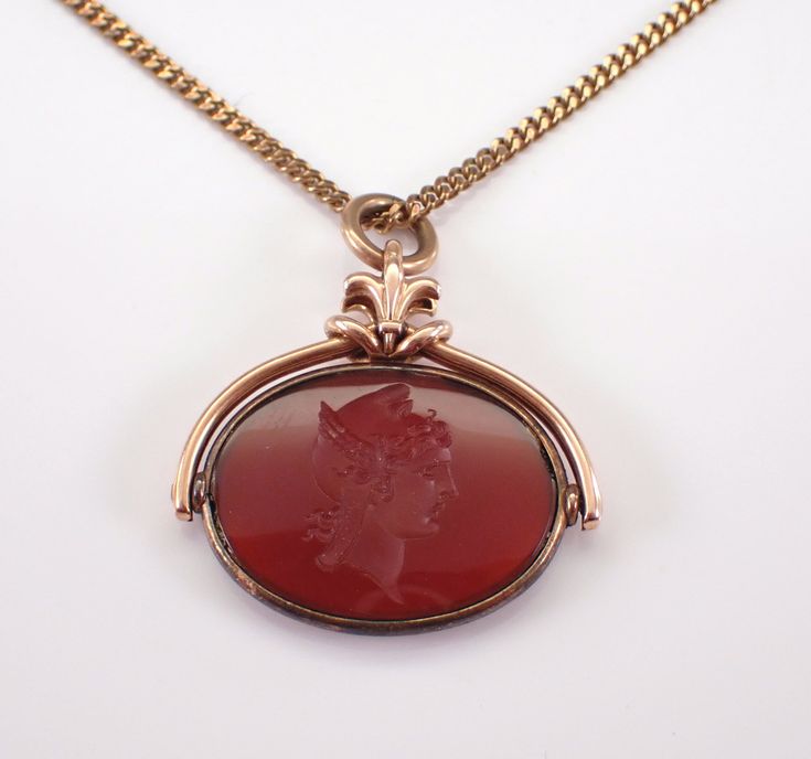 Yellow Gold Antique Victorian Carnelian Intaglio Pendant with Chain.  The pendant measures 24 X 25 mm and has a Carnelian carved Intaglio on one side that can flip to the other.  The Carnelian measures 20 X 15mm. This pendant is 8K Yellow Gold and comes with an 18" 8K Yellow Gold Chain.  This necklace weighs 8.2 grams and dates back to Circa 1900's. I will ship this pendant promptly in a beautiful gift box. Luxury Vintage Carnelian Necklace, Formal Cameo Jewelry In Carnelian, Formal Carnelian Cameo Jewelry, Formal Cameo Carnelian Jewelry, Vintage Carnelian Jewelry With Polished Finish, Vintage Polished Carnelian Jewelry, Antique Necklaces With Polished Finish For Collectors, Antique Oval Carnelian Jewelry, Cameo Carnelian Jewelry Gift