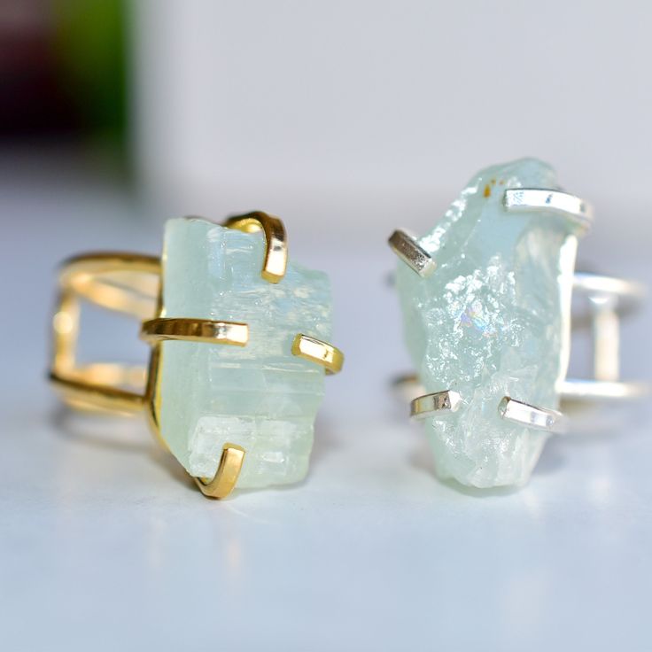 This is a fabulous raw aquamarine crystal set in a statement, four claw silver or gold coated adjustable ring, so that the aquamarine is the star of the show.  This is an aquamarine crystal left in its natural state giving it a boho and mystical look to it. These handmade rings are one of a kind and made with genuine aquamarine that has not been enhanced in any way, and has not been cut and polished. Aquamarine helps us to gain insight, truth, and wisdom. It can be used to help calm the mind, ne Minimalist Aquamarine Ring Jewelry, Minimalist Aquamarine Jewelry, Aquamarine Crystal Gemstone Ring Gift, Aquamarine Gemstone Crystal Ring Gift, Aquamarine Gemstone Crystal Ring For Gift, Aquamarine Crystal Ring With Gemstone For Gift, Adjustable Aquamarine Jewelry As Gift, Modern Aquamarine Birthstone Jewelry, Unique Raw Jewelry For Gifts