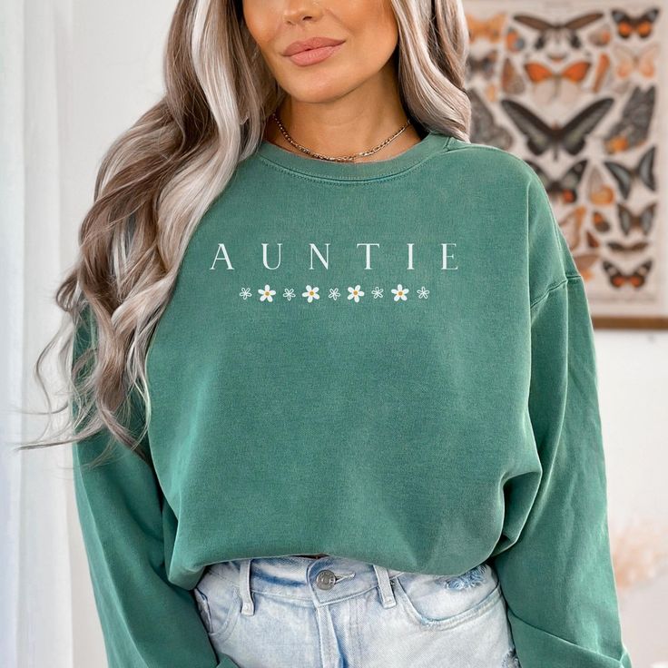 Wonderful design for women who loves Auntie letter design sweatshirt.Grab this design as a gift for your girlfriend,sister,mother or who loves Aunt sweater.Or make yourself happy to have this cute design sweatshirt :) An Auntie sweatshirt is a type of sweater that features a design inspired by the Aunt gift.Auntie sweatshirts are popular among Auntie letter sweatshirt lovers and make a great gift for any Aunt enthusiast. 🌿 Made from premium quality, soft cotton fabric, this shirt ensures all-da Casual Long Sleeve Sweatshirt With Name Print, Casual Name Print Sweatshirt For Winter, Green Long Sleeve Sweatshirt With Lettering, Casual Winter Sweatshirt With Name Print, Green Sweater With Letter Print In Relaxed Fit, Green Relaxed Fit Sweater With Letter Print, Winter Name Print Relaxed Fit Sweatshirt, Casual Crew Neck Sweater With Name Print, Winter Sweatshirt With Name Print In Relaxed Fit