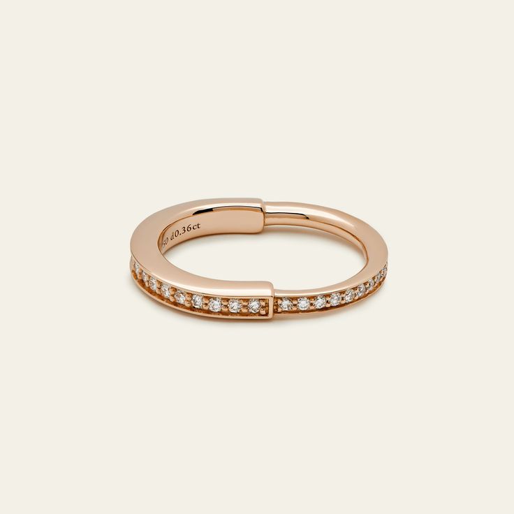 Tiffany & Co. Lock Ring in Rose Gold with Pavé Diamonds The Tiffany & Co. Lock ring is a bold symbol of unity and diversity, celebrating personal connections that shape us. Crafted in 18k rose gold with round brilliant diamonds totaling 0.38 carats, this ring is a stylish choice whether worn alone or as part of your everyday ring collection. Details 18k Rose Gold TTL Carat: 0.38ct Size: 6.5 Product Number: 72791584 Classic Rose Gold Stackable Rings With Brilliant Cut, Luxury Rose Gold Diamond Ring For Anniversary, Luxury Rose Gold Diamond Ring With Polished Finish, Luxury Rose Gold Promise Stackable Rings, Refined Rose Gold Promise Ring Jewelry, Luxury Rose Gold Diamond Promise Ring, Luxury Rose Gold Promise Diamond Ring, Luxury 14k Rose Gold Diamond Ring For Anniversary, Luxury 14k Rose Gold Diamond Anniversary Ring